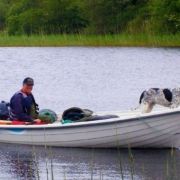 Man and dog fishing in Leitrim